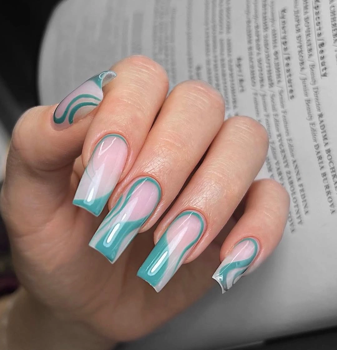 Medium nude square nails with turquoise and white swirl accents