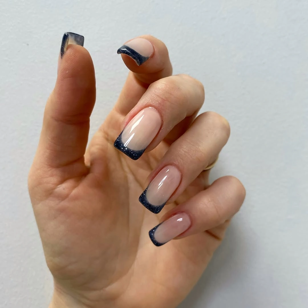 dark glitter French tips on nude square nails