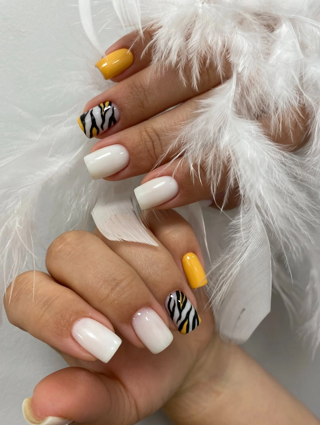 mustard yellow square nails with zebra accents