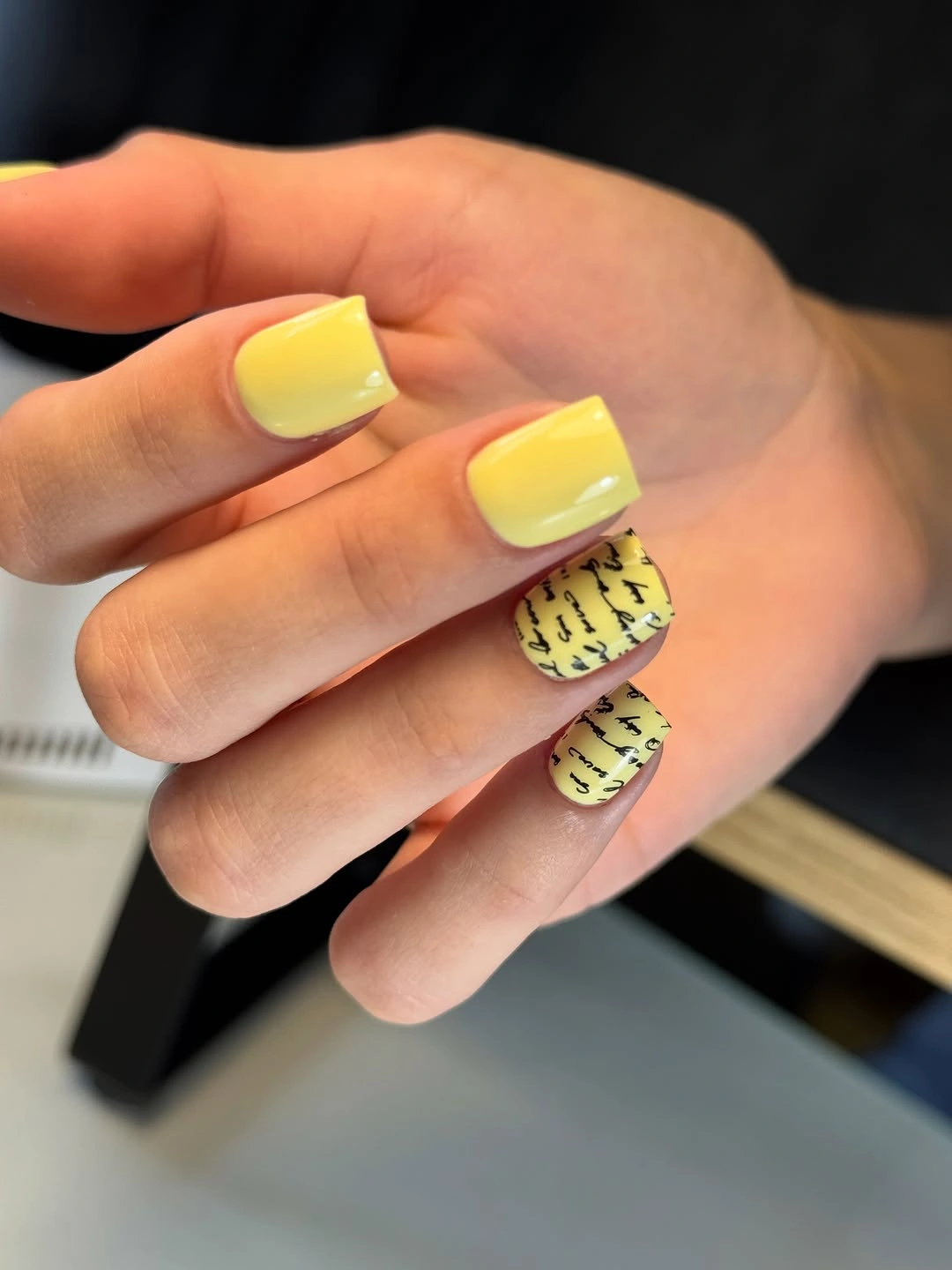 butter yellow square nails with black accents