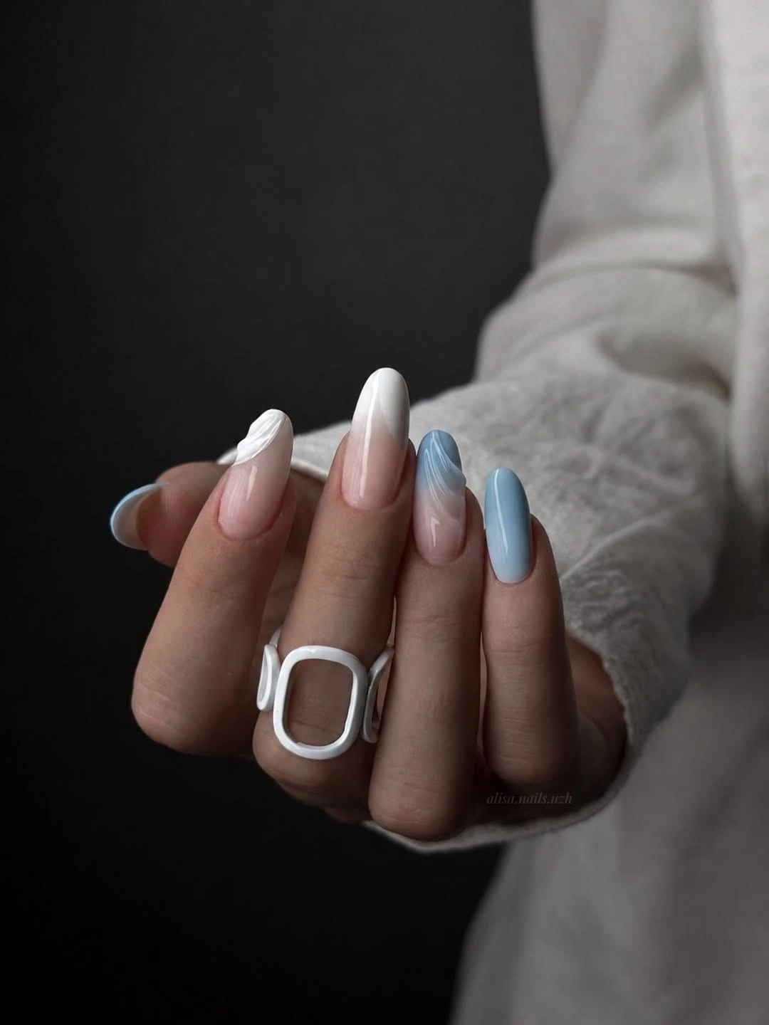 milky white and pale blue almond nails