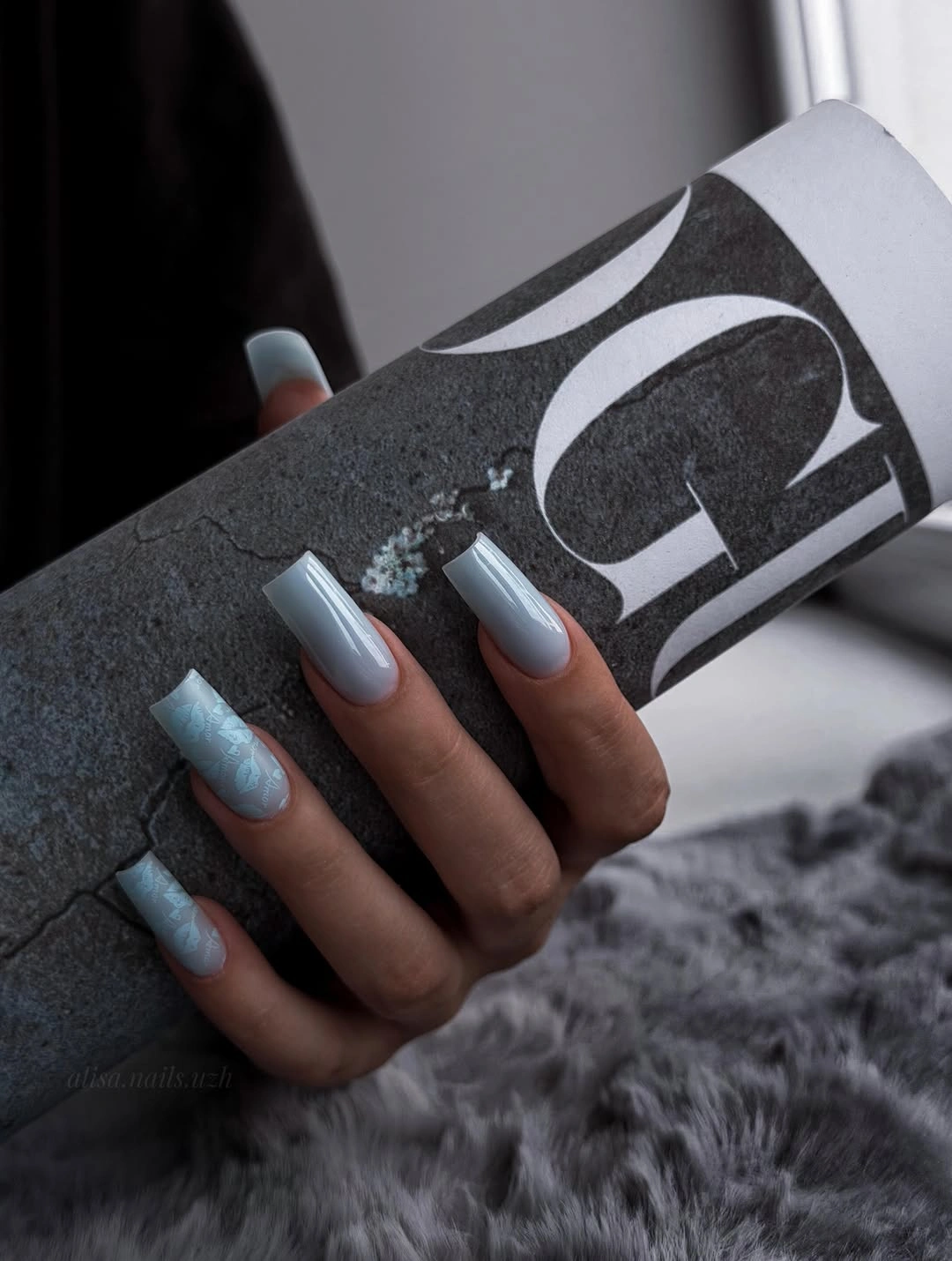 pale blue square nails with subtle accents