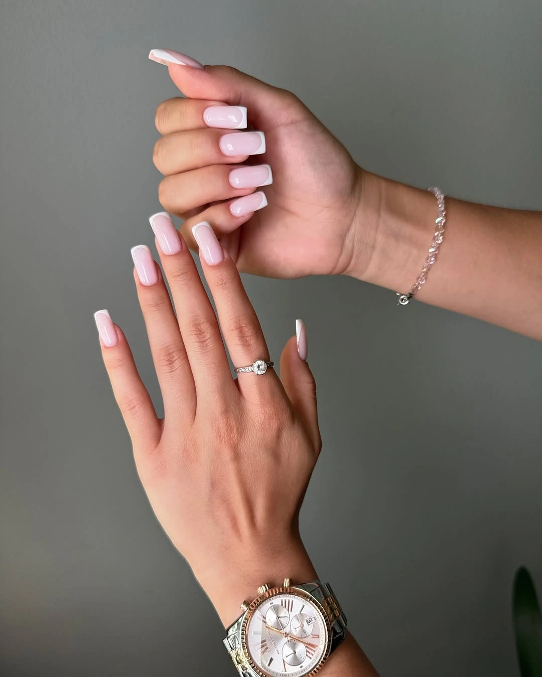 Long pale pink square nails with a glossy solid finish