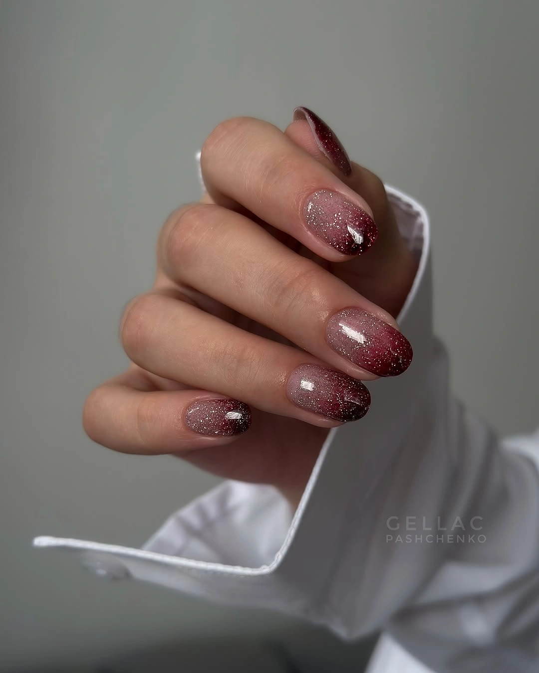 Short dusty rose almond nails with delicate glitter accents
