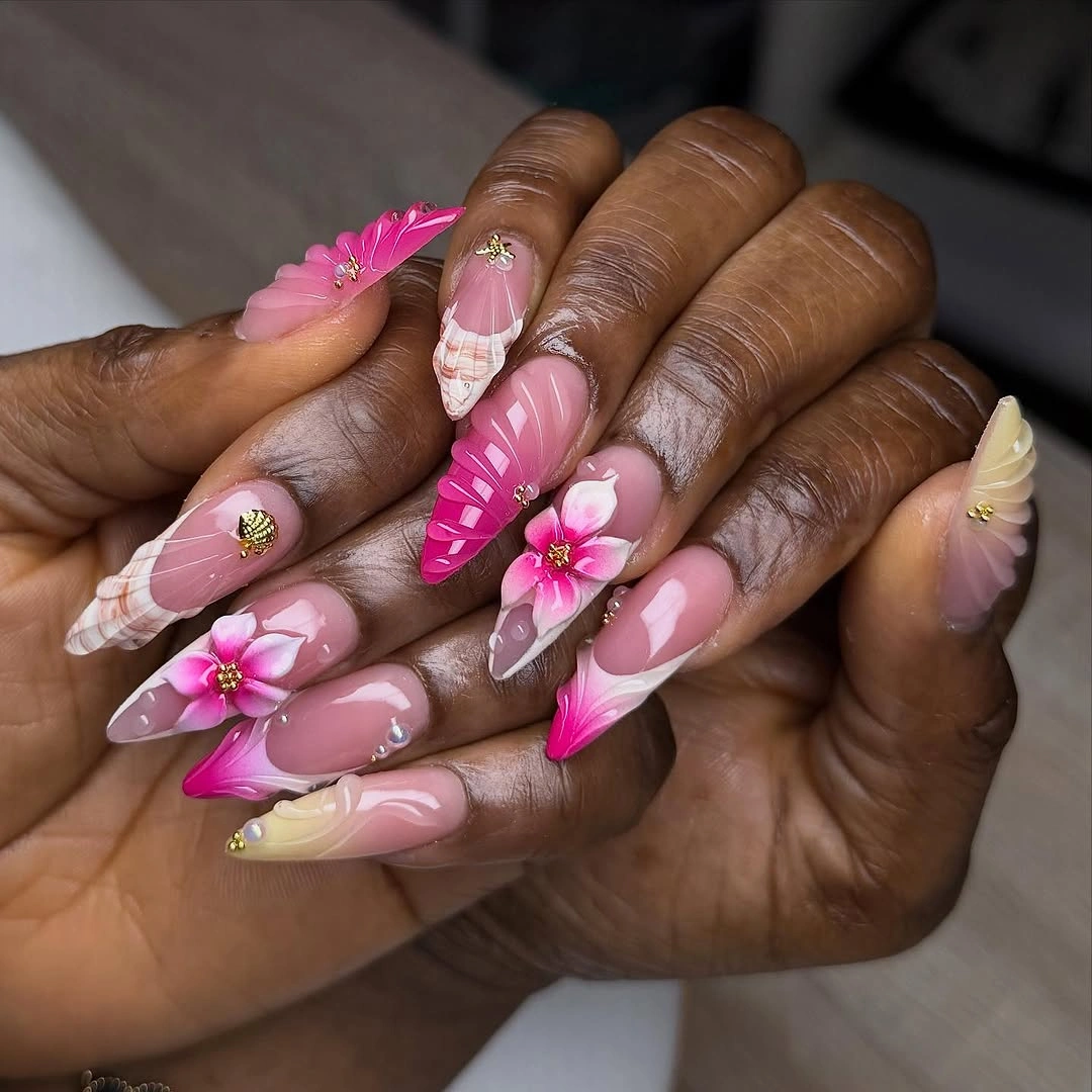 very long pink stiletto nails with large raised floral accents