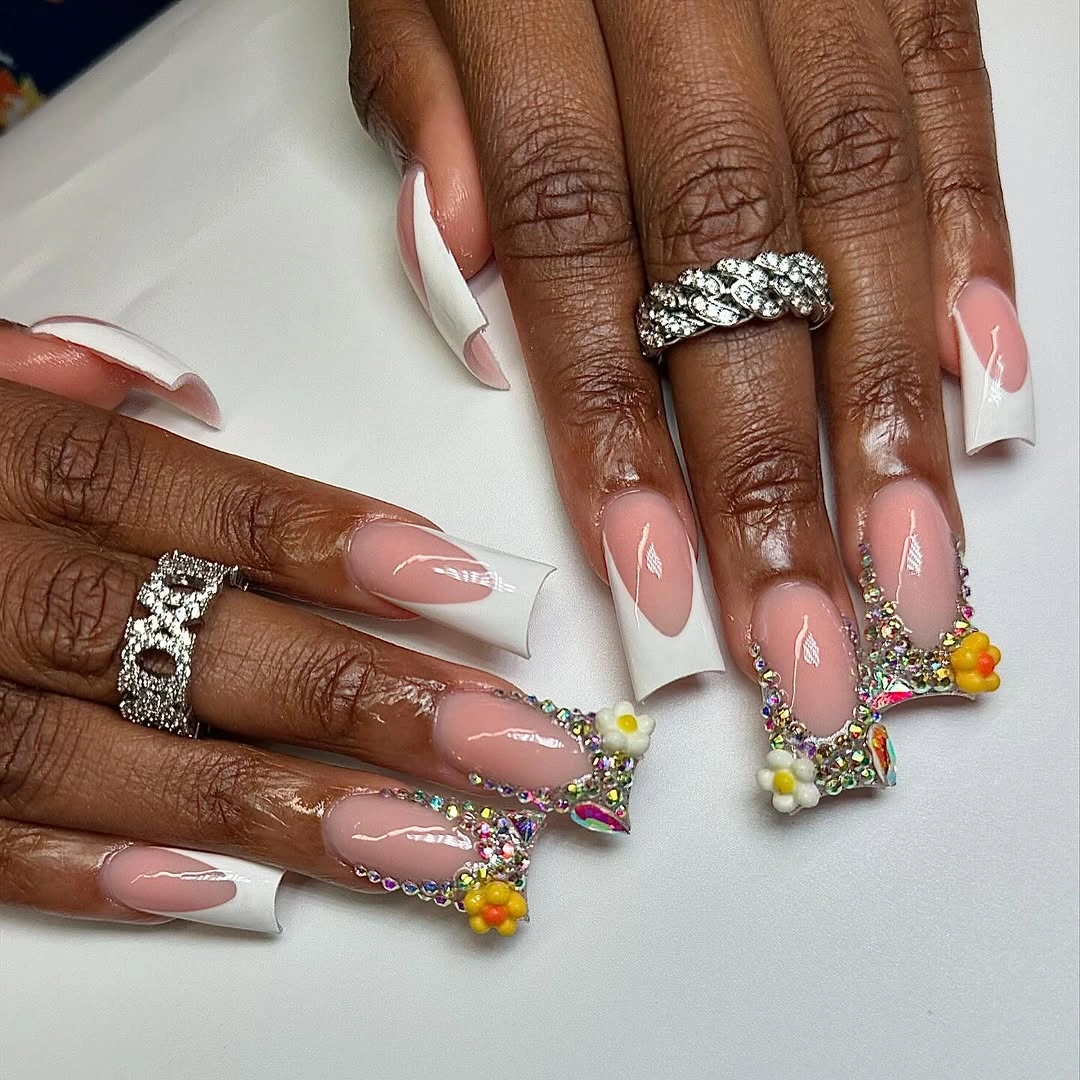 long pink white square nails with flowers and gold accents