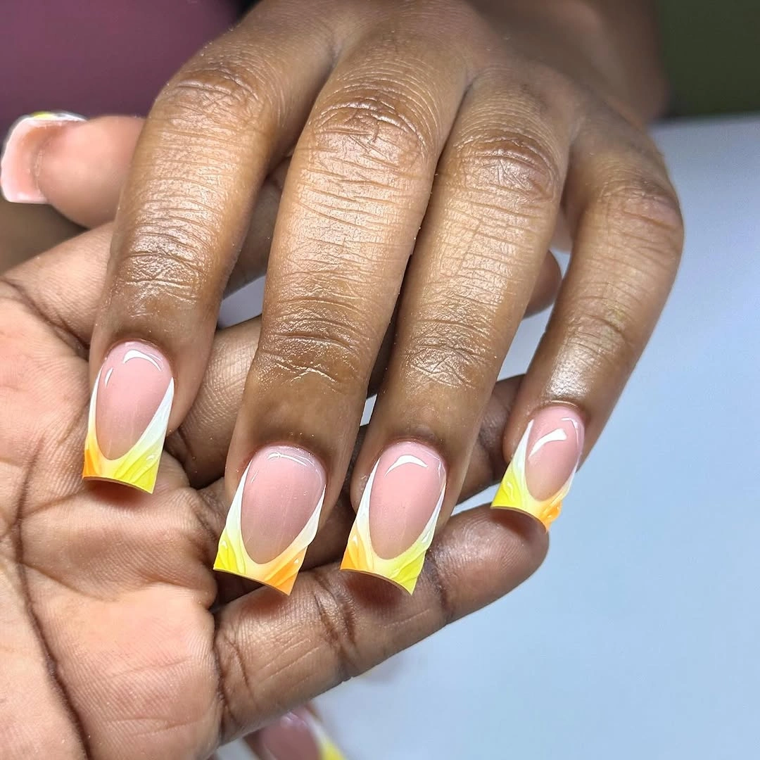 pink almond nails with bright yellow French tips