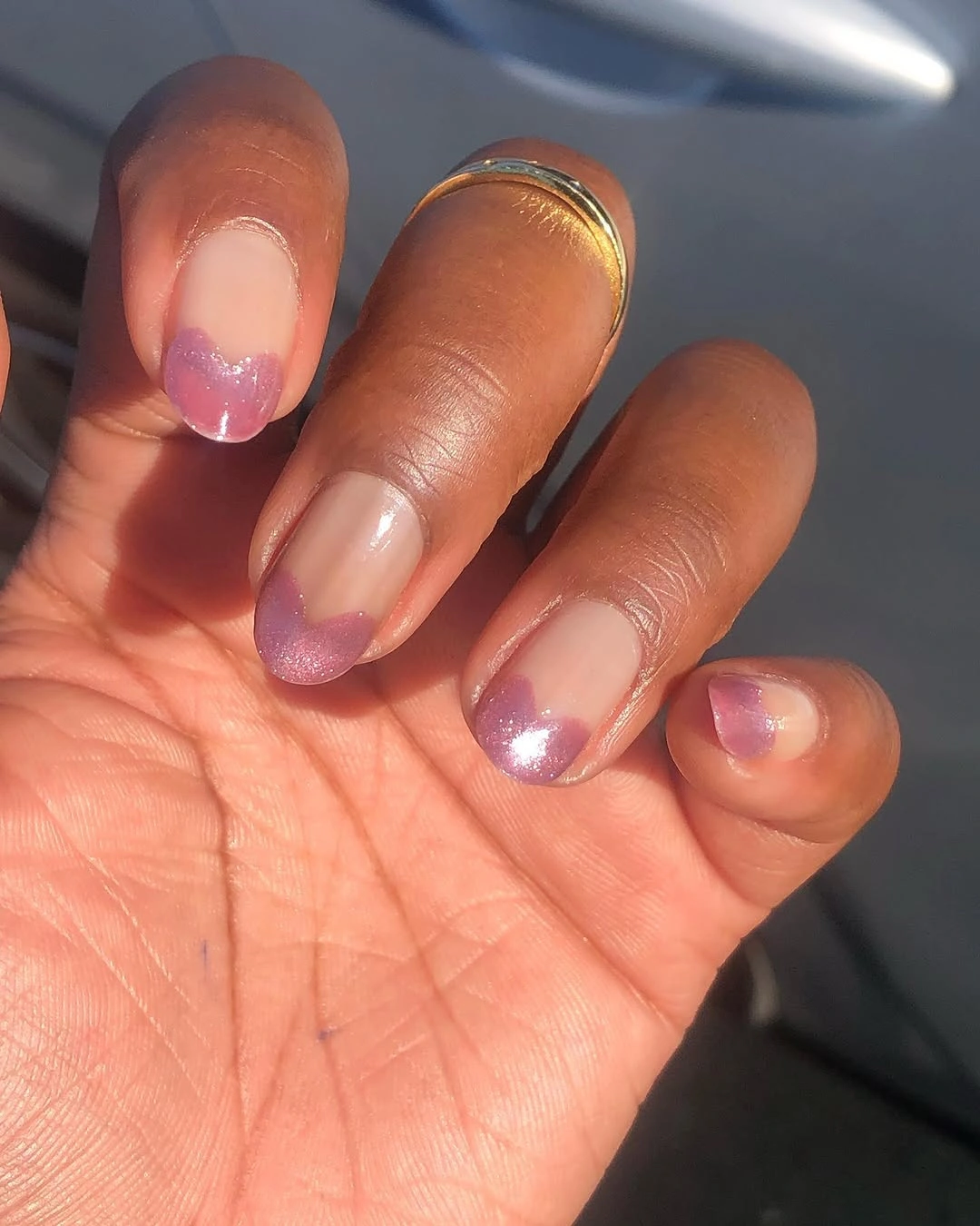 sheer pink almond nails with coral and lilac color at tips