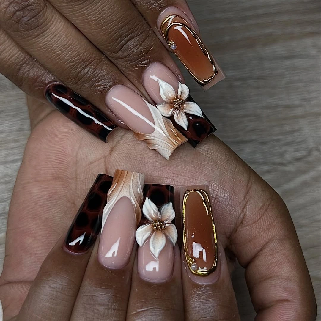 long tapered nails with tortoiseshell brown floral nude accents