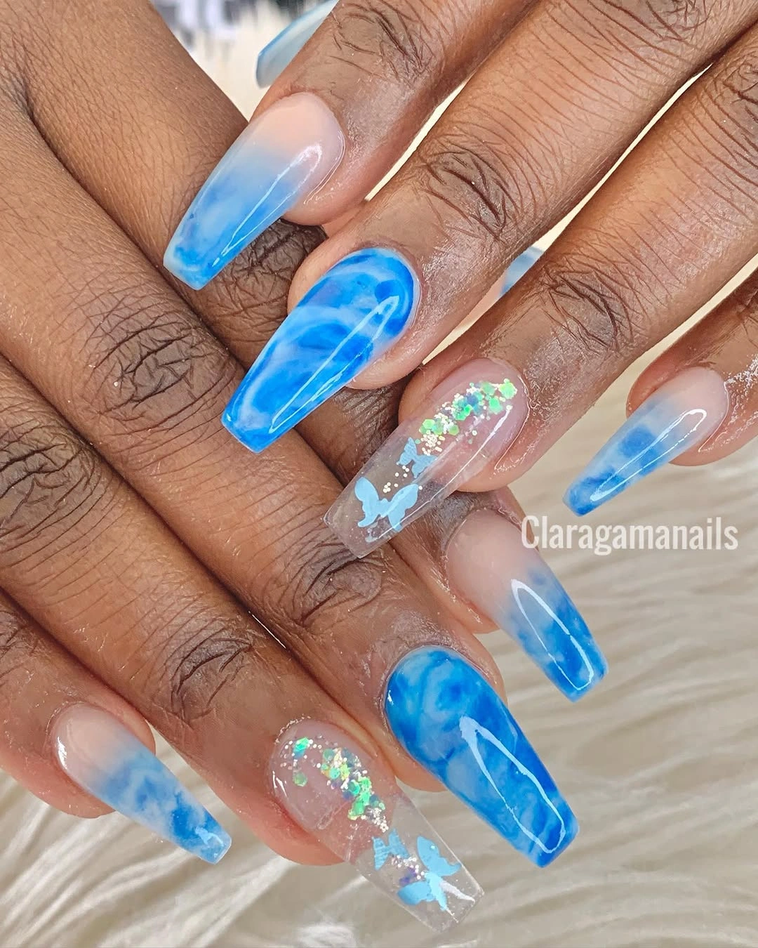 Blue marble coffin nails with clear butterfly accents