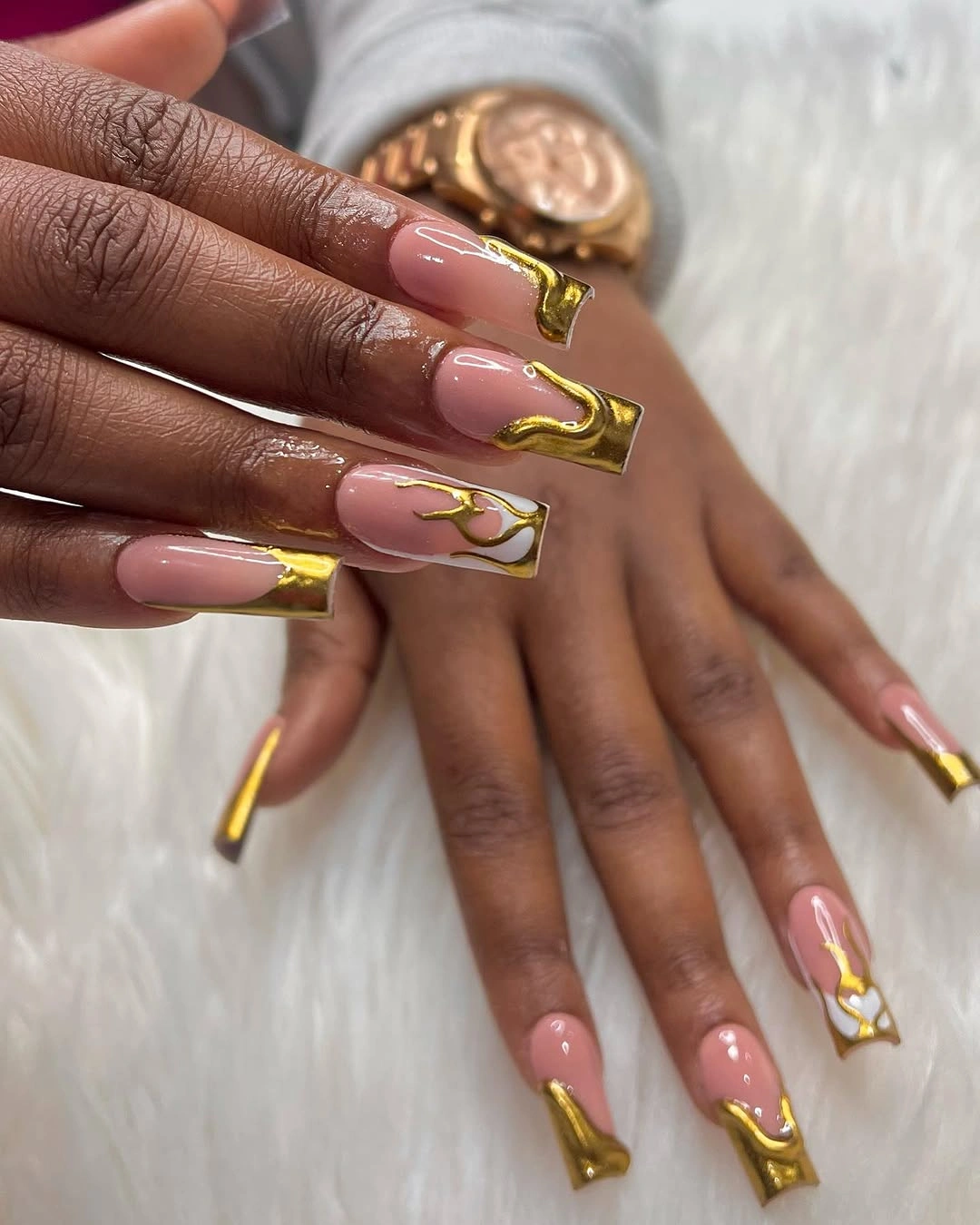 Gold tipped square nails with nude pink bases