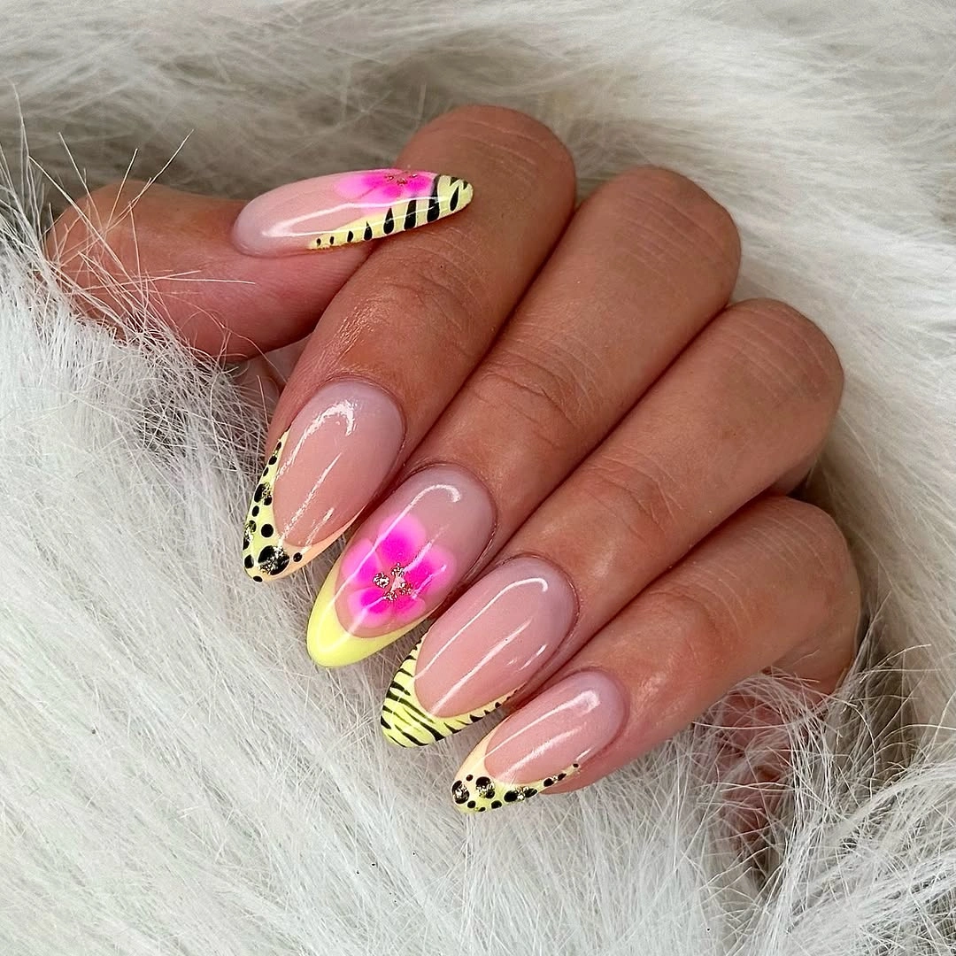 Yellow animal print French nails with pink flowers