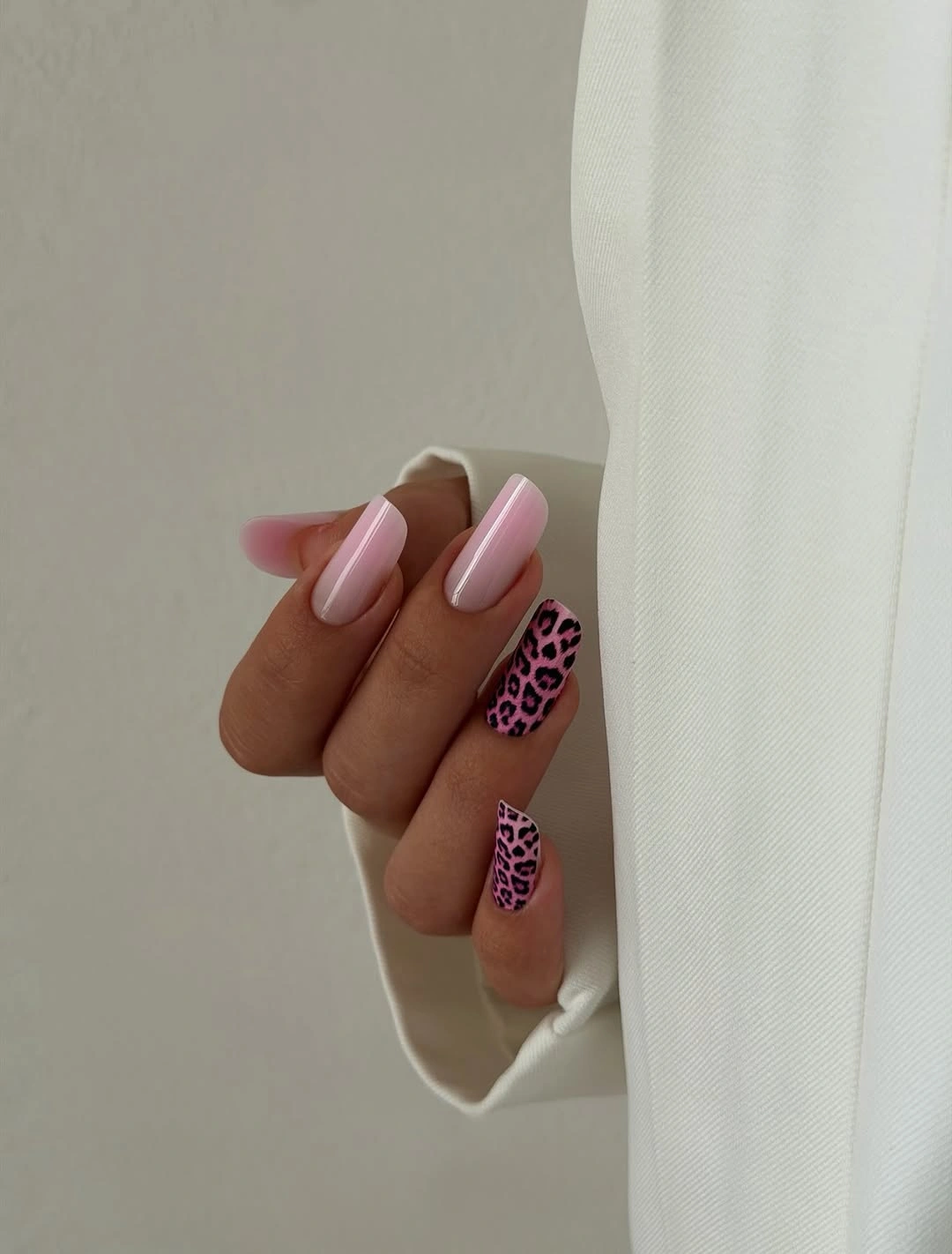 Pink nude almond nails with burgundy and spotted accents