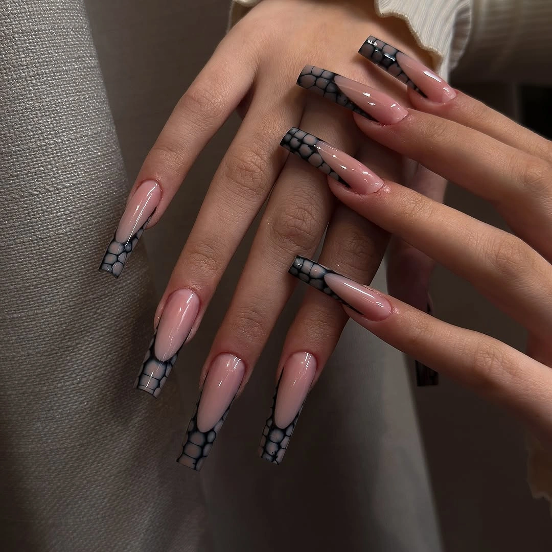 Long pink nails with black white checkered tips