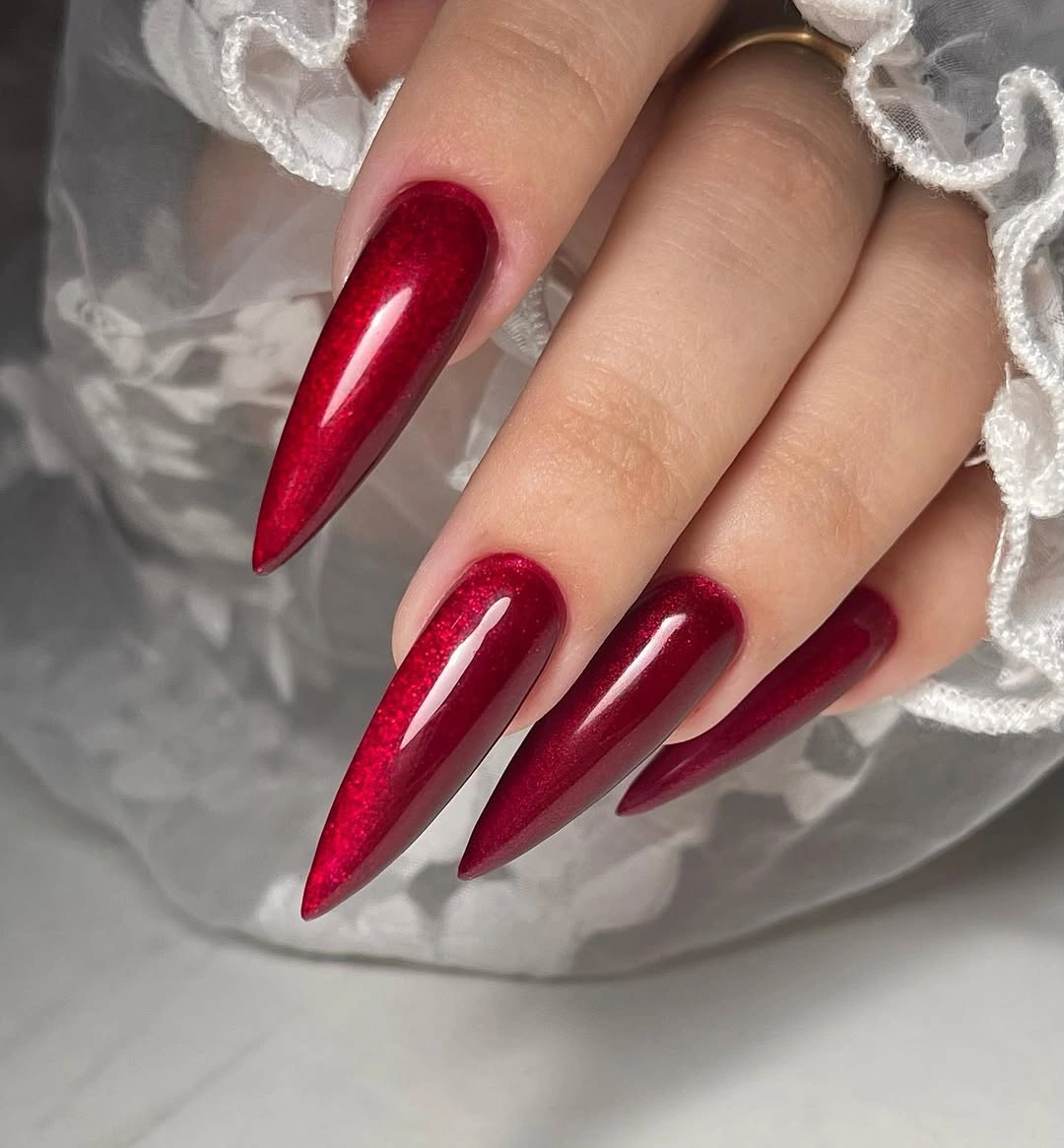 Long deep red glossy stiletto nails