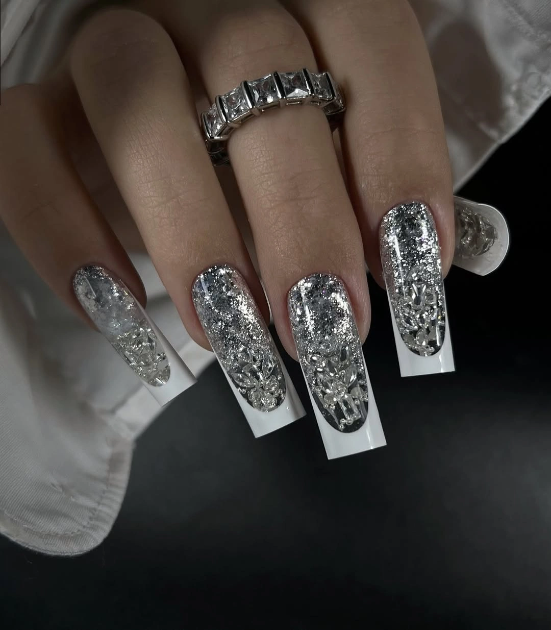 Long square nails with dense silver glitter and white edges