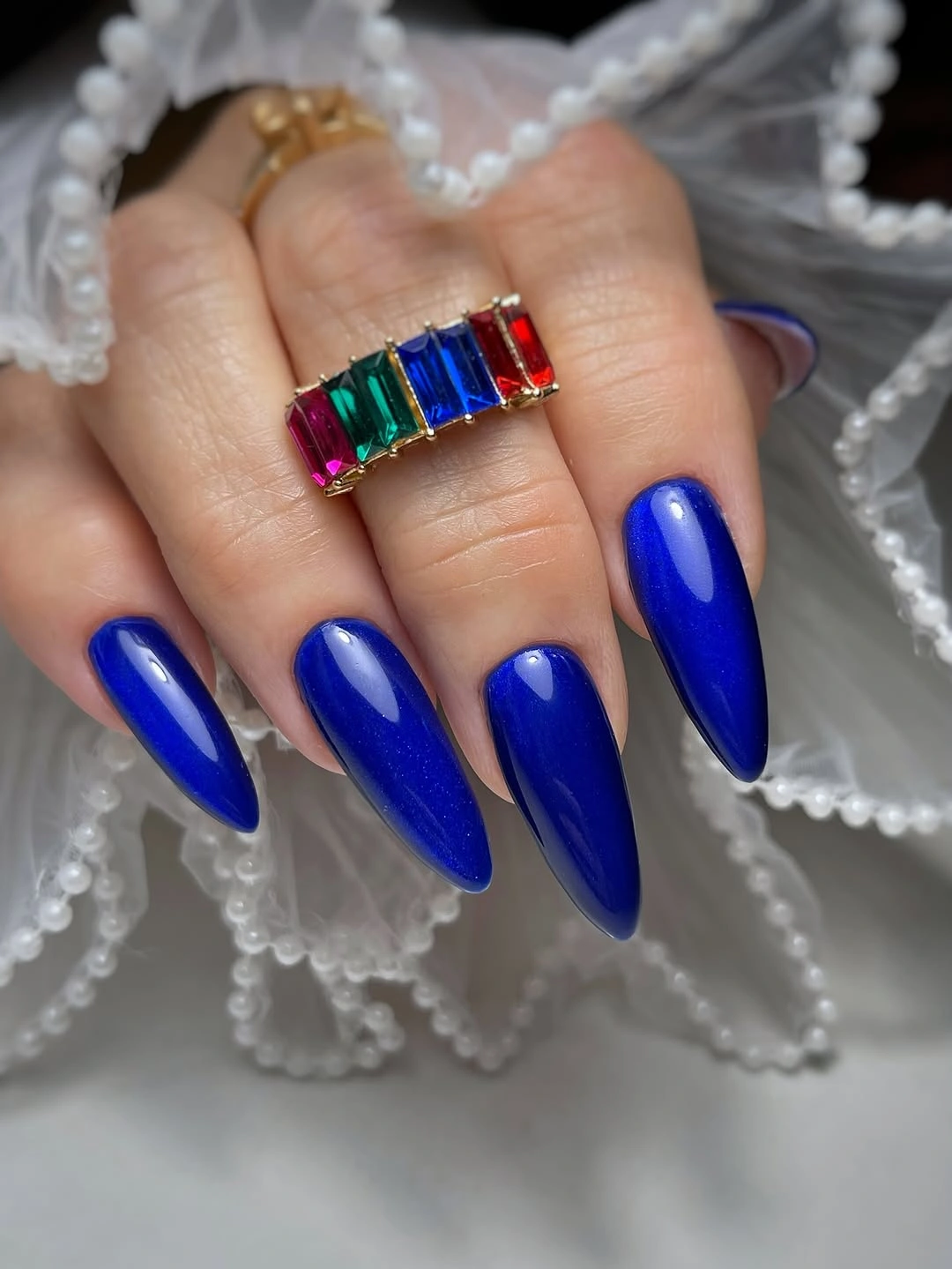 Long glossy cobalt blue stiletto nails