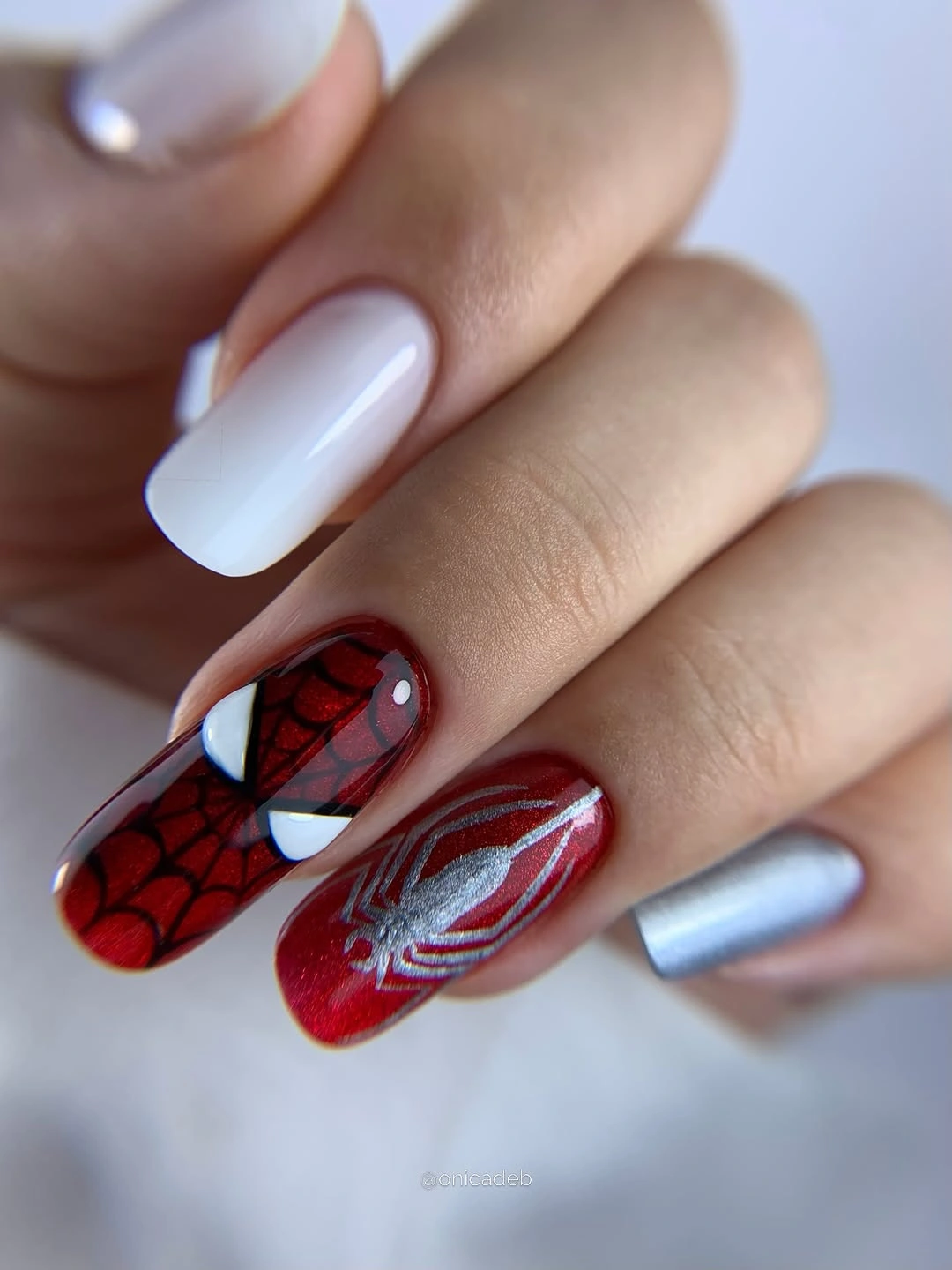 Square nails with red black white and graphic panels