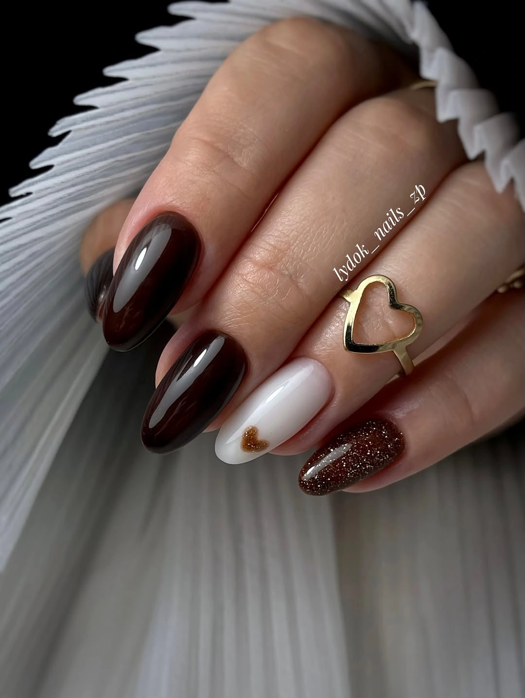 Short glossy espresso nails with white and glitter accents