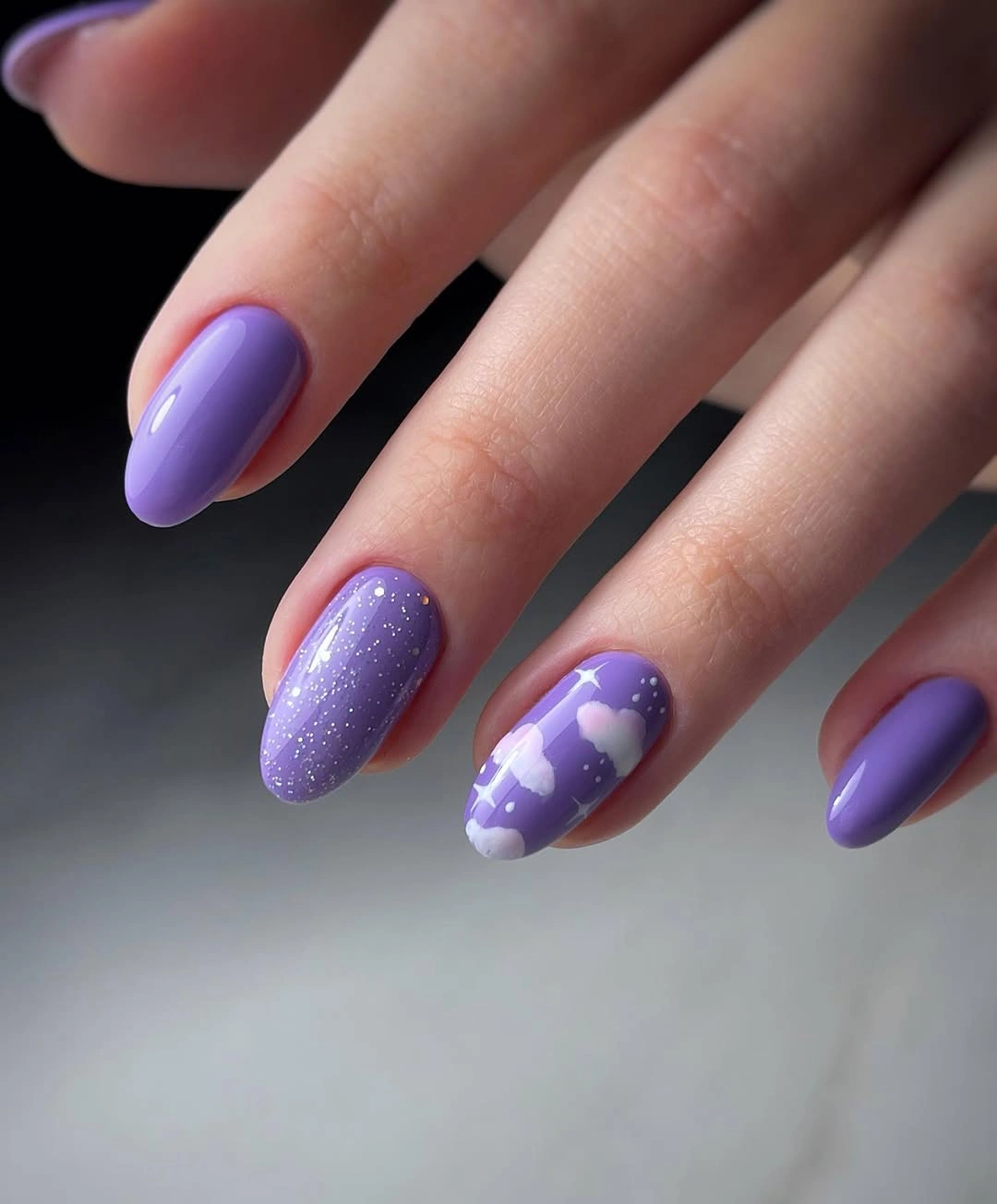 Short lavender nails with glitter and heart accents