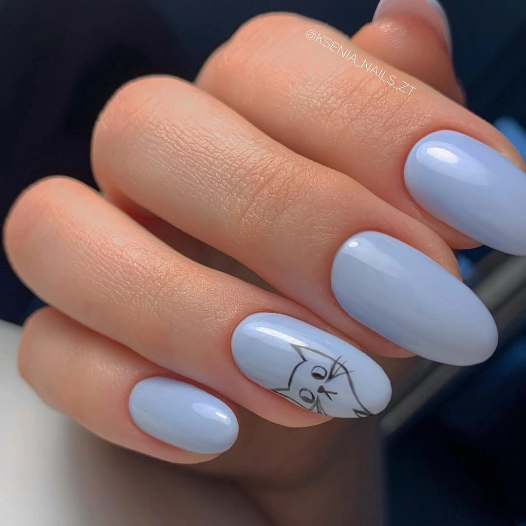 Pale blue nails with one white graphic accent nail