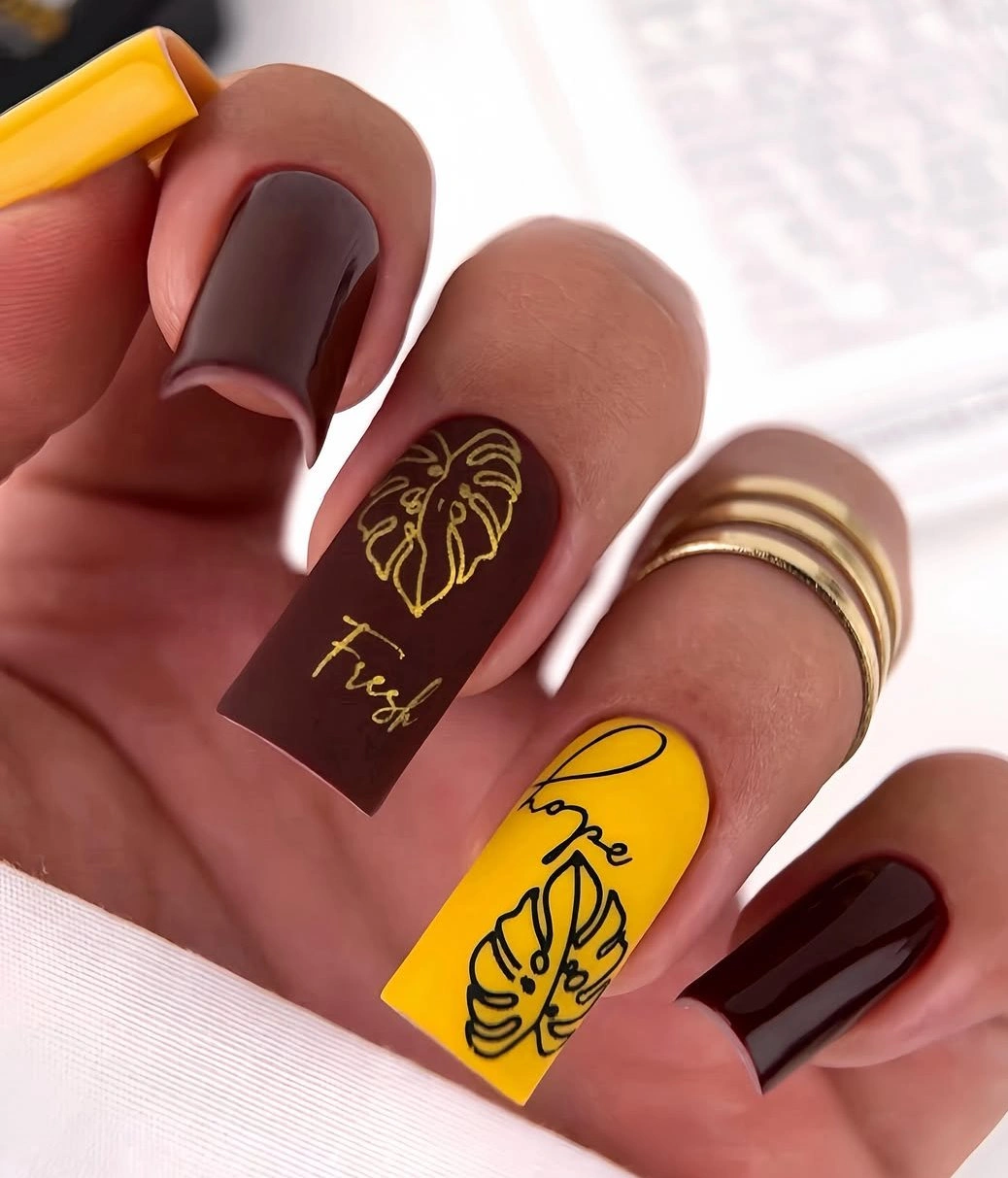 Long brown mustard and nude nails with graphic line art