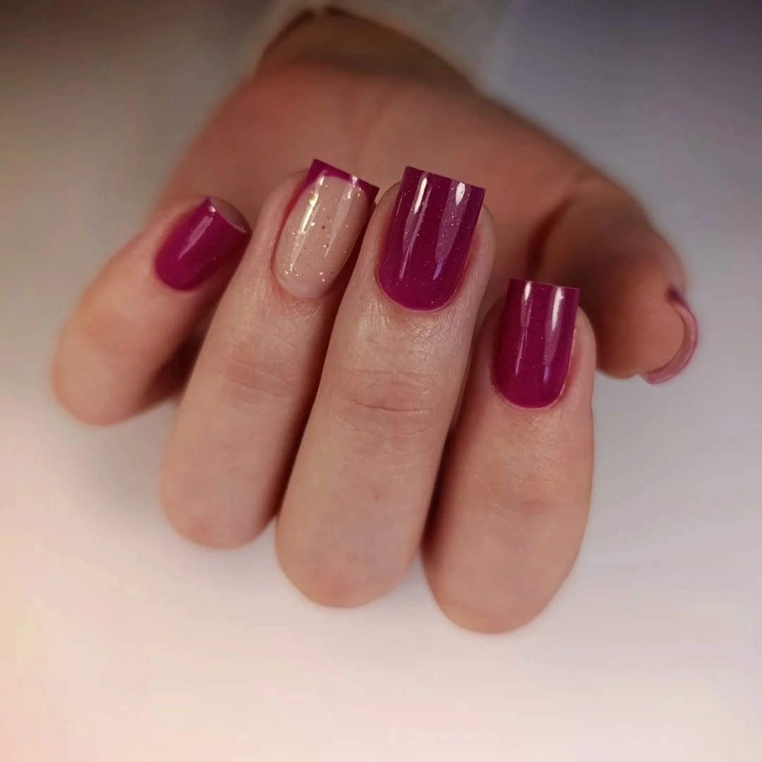 Short magenta square nails with one pale shimmer accent