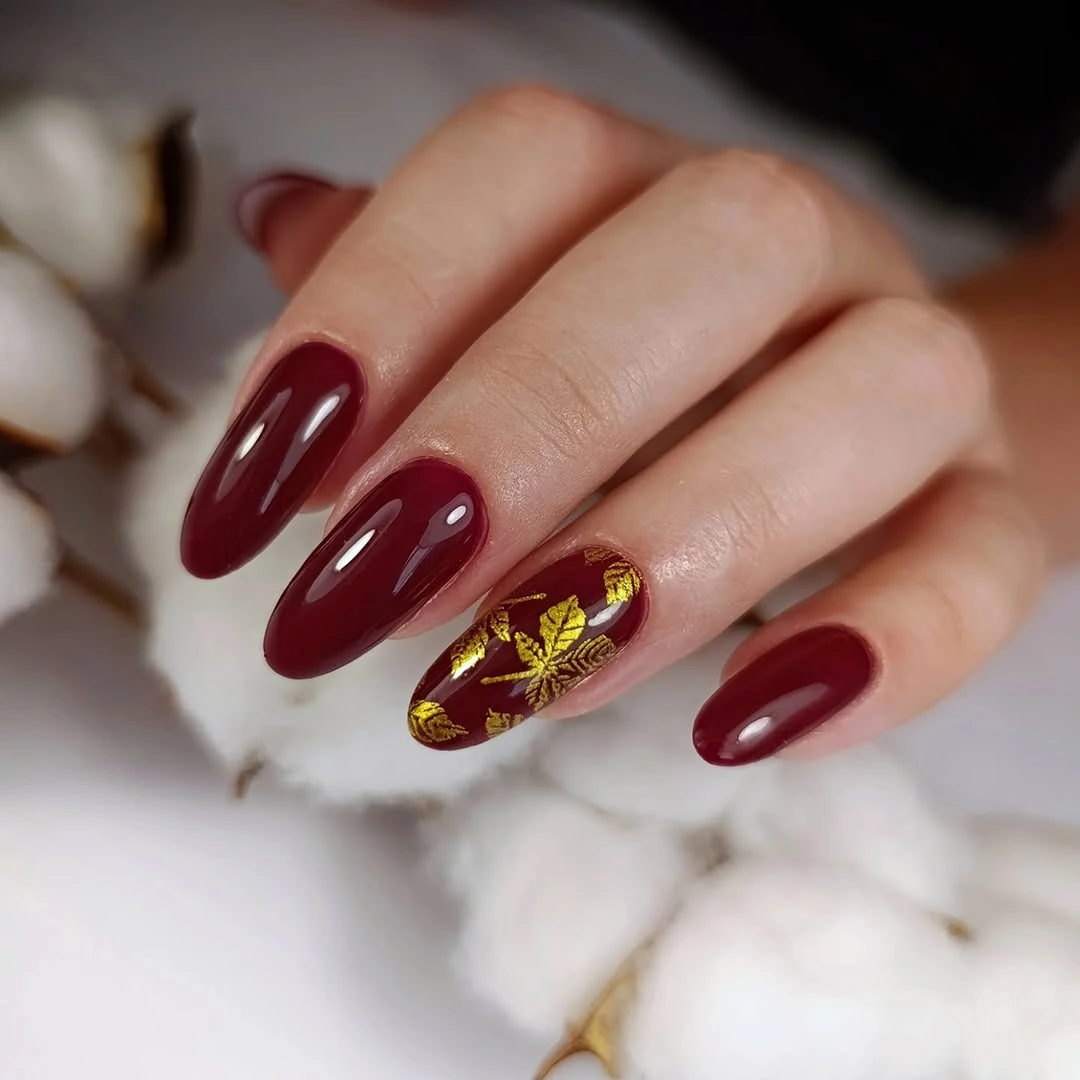 Nude square nails with gold foil accents and wine color