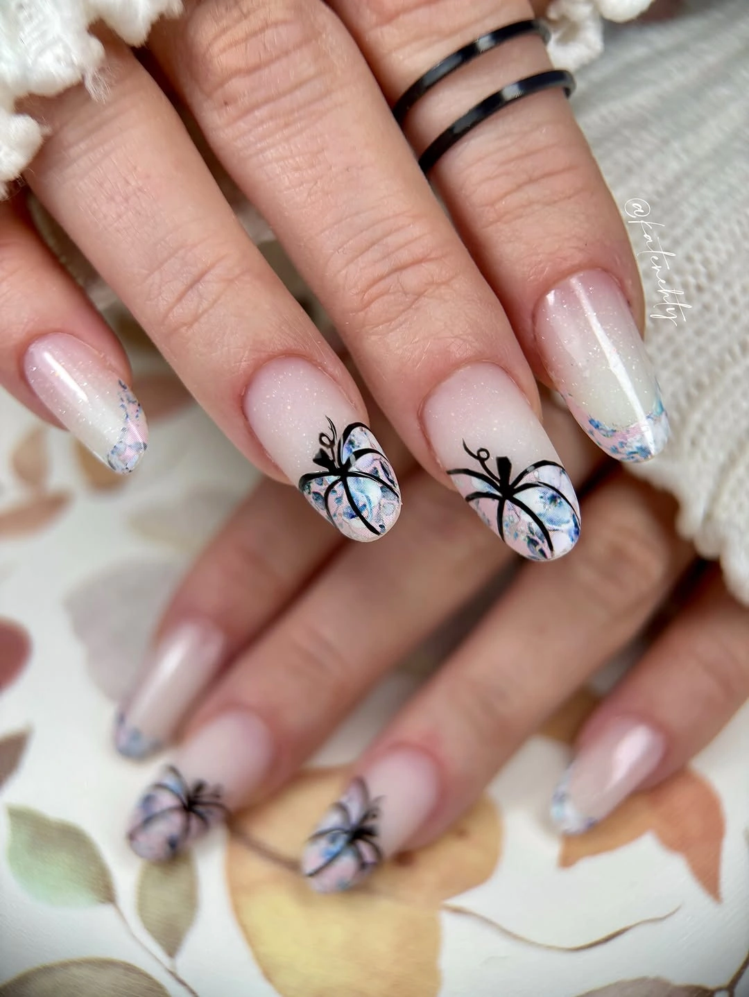 Short pink nails with cool glitter tips and black line art