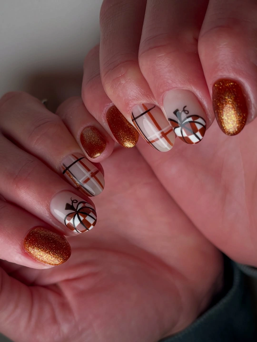 Copper glitter almond nails with rust plaid accents