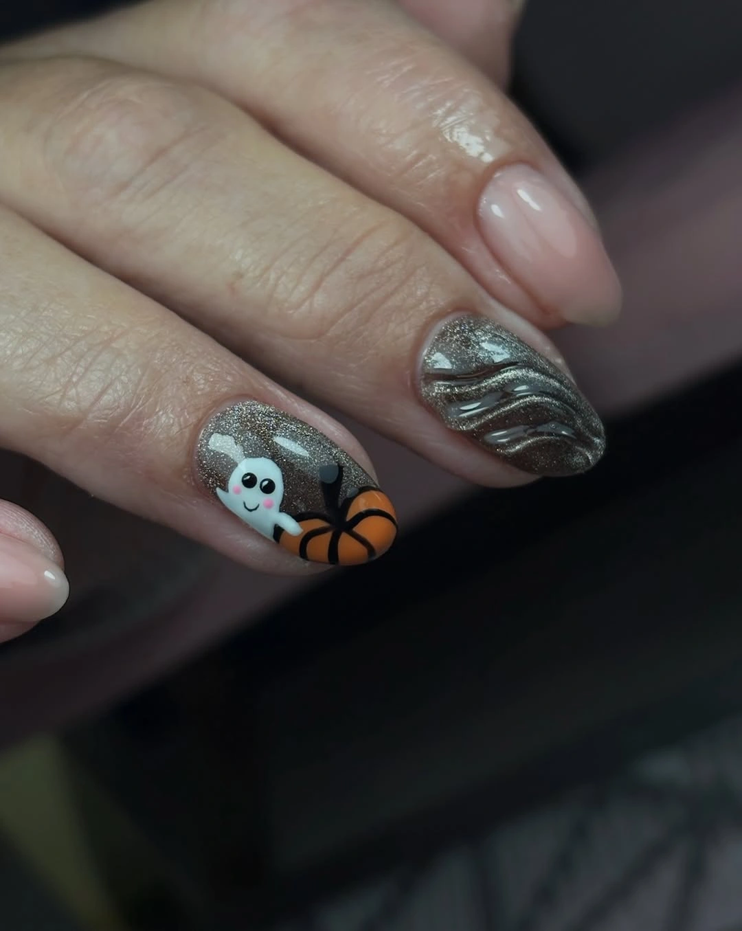 Smoky gray short nails with a ghost and orange pumpkin