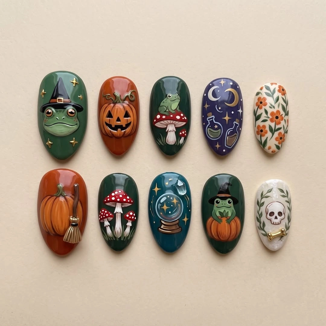 Ten colorful nail tips with pumpkins ghosts and harvest motifs