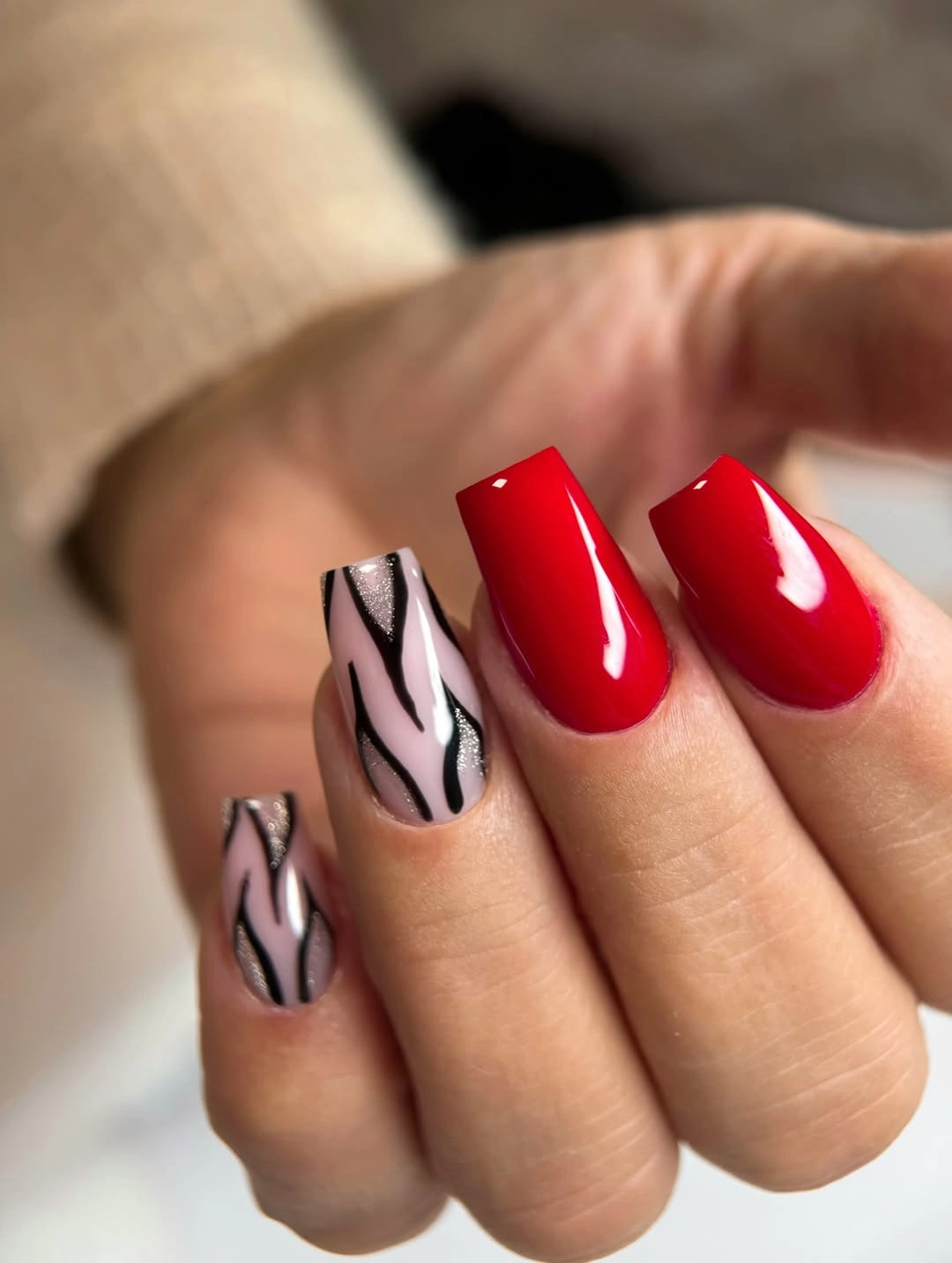 Red square nails with neutral graphic accents