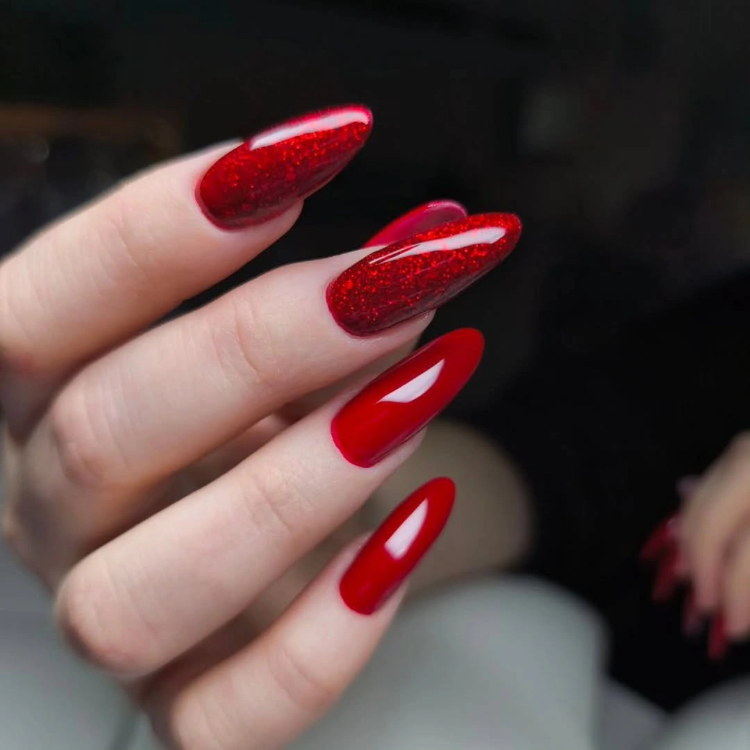 Red almond nails with tone on tone glitter