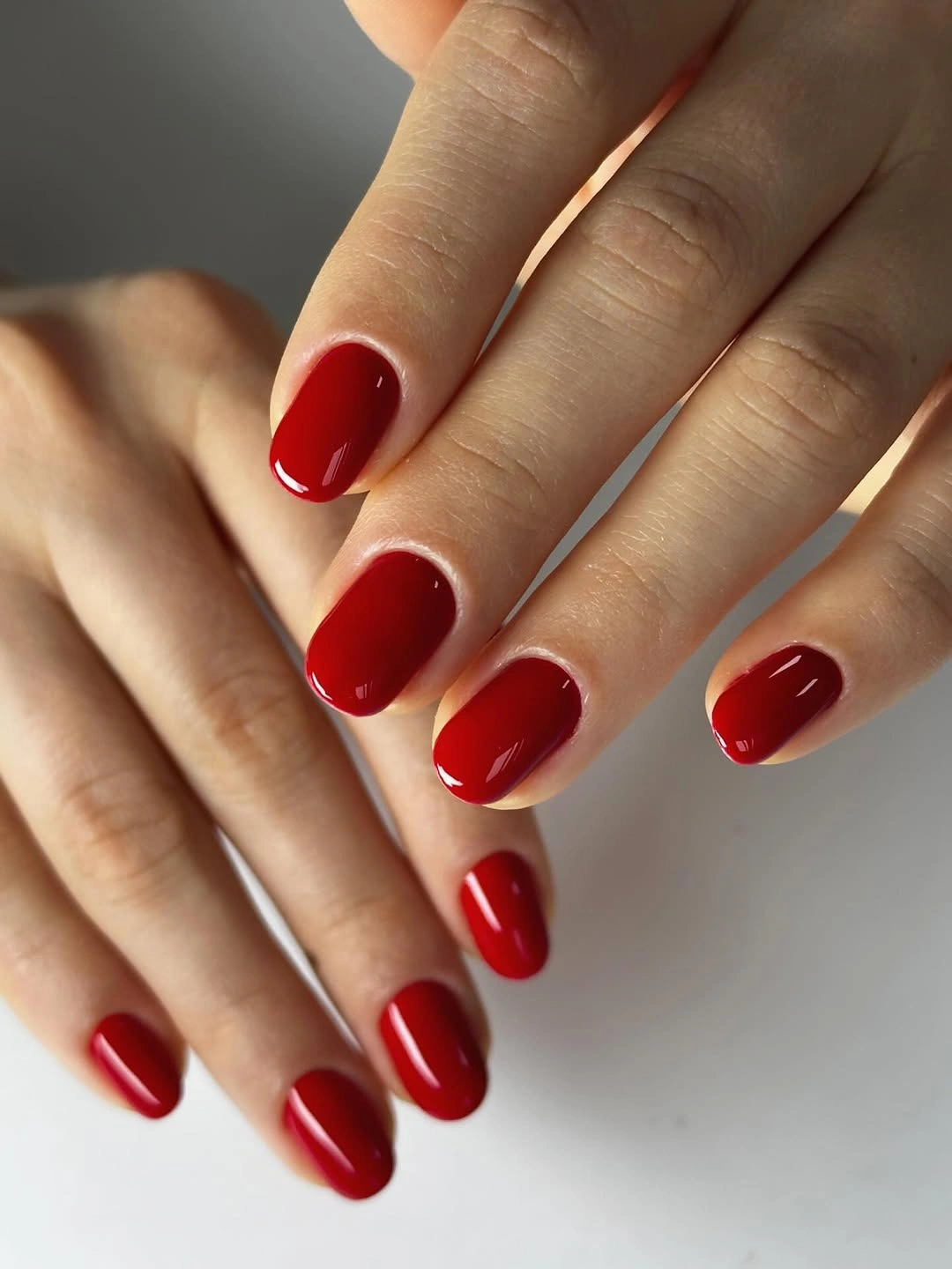 Clean short oval glossy red nails