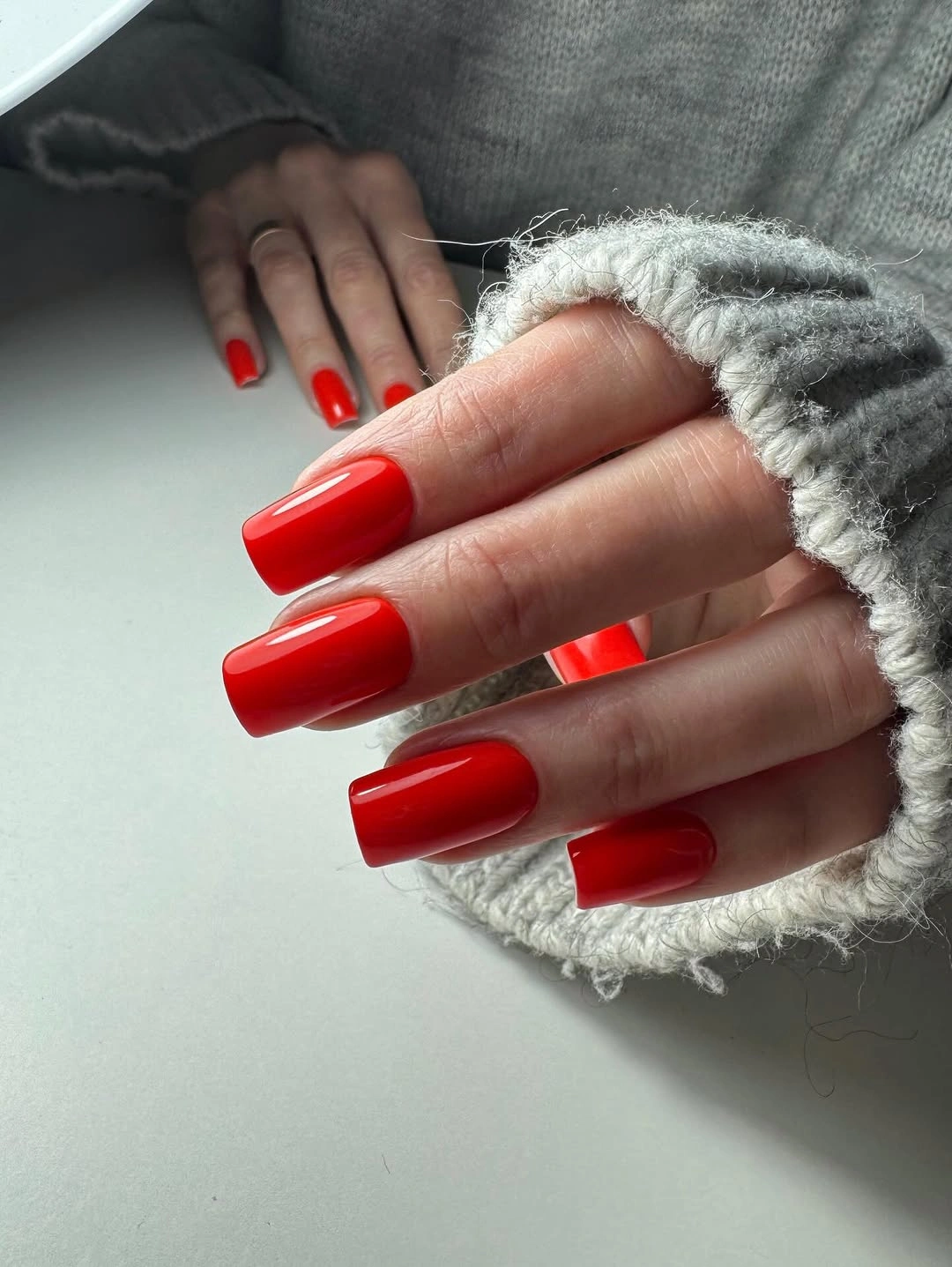 Long square red nails with gray knit