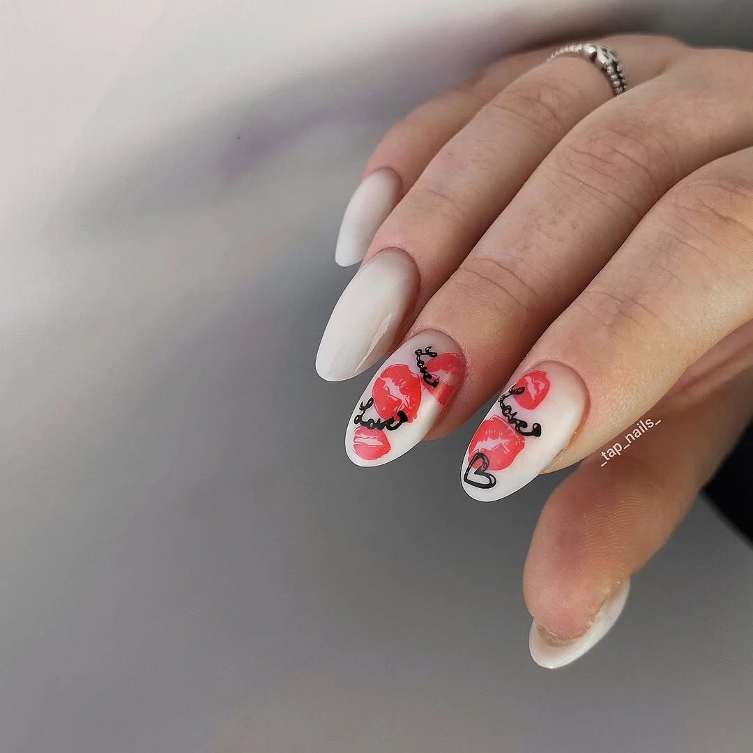 Pale almond nails with tiny red and pink accent art