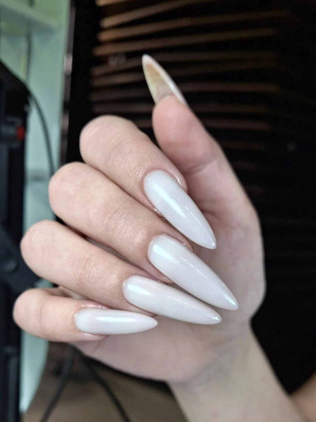 Long milky white almond nails with glossy finish