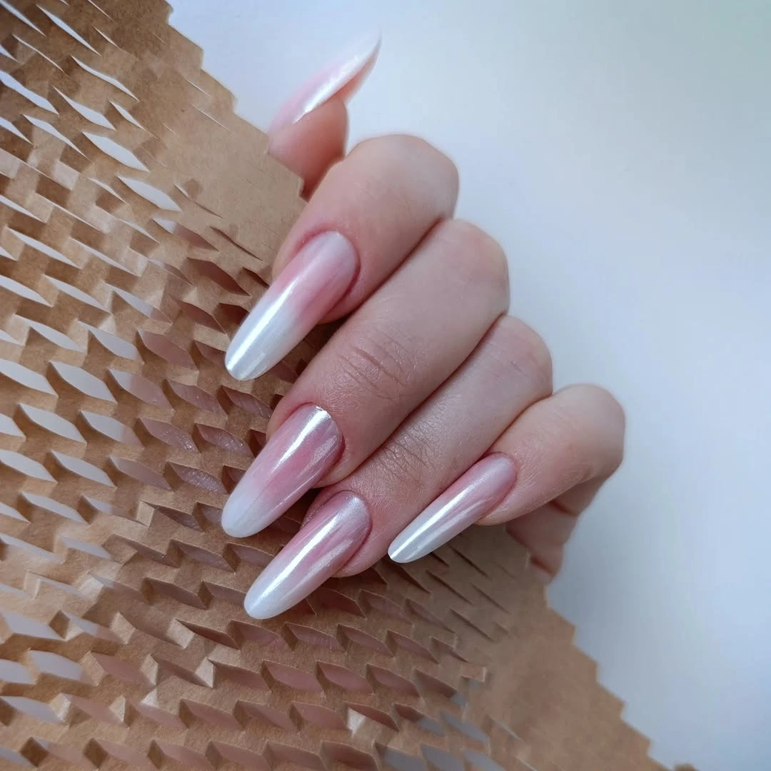 Sheer pink almond nails with pale gradient tips
