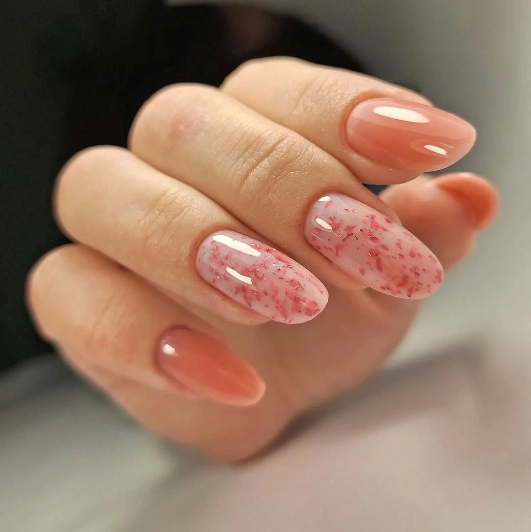 Peach almond nails with soft pink marbled accents