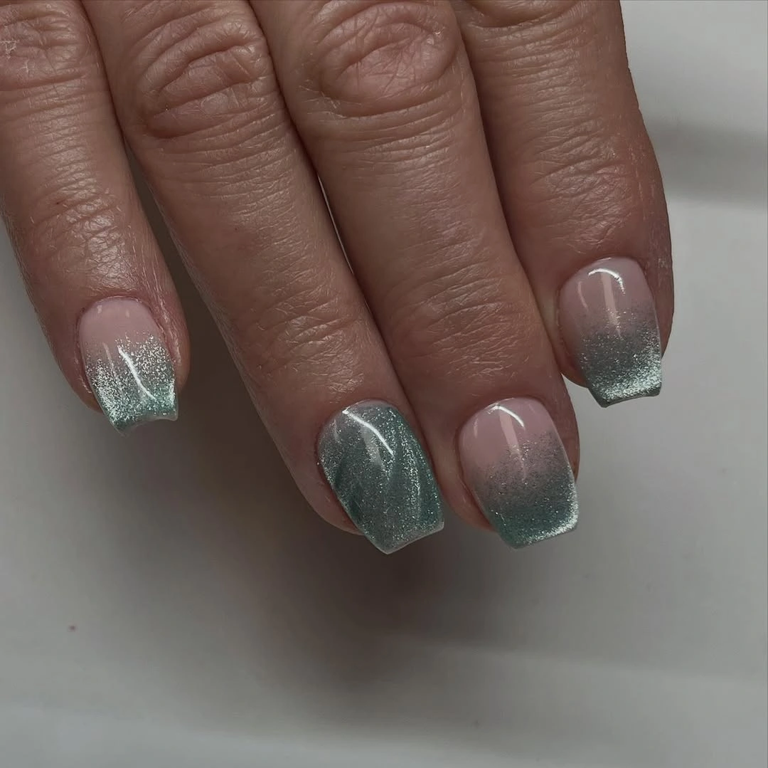 Short square nails with muted green silver fading at the tips