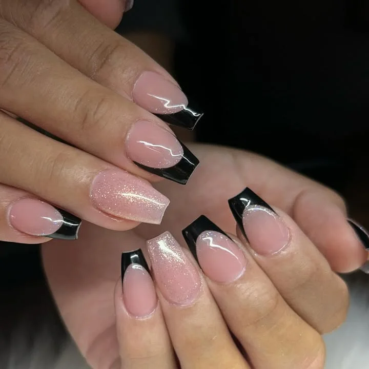Short nude pink coffin nails with bold black square tips