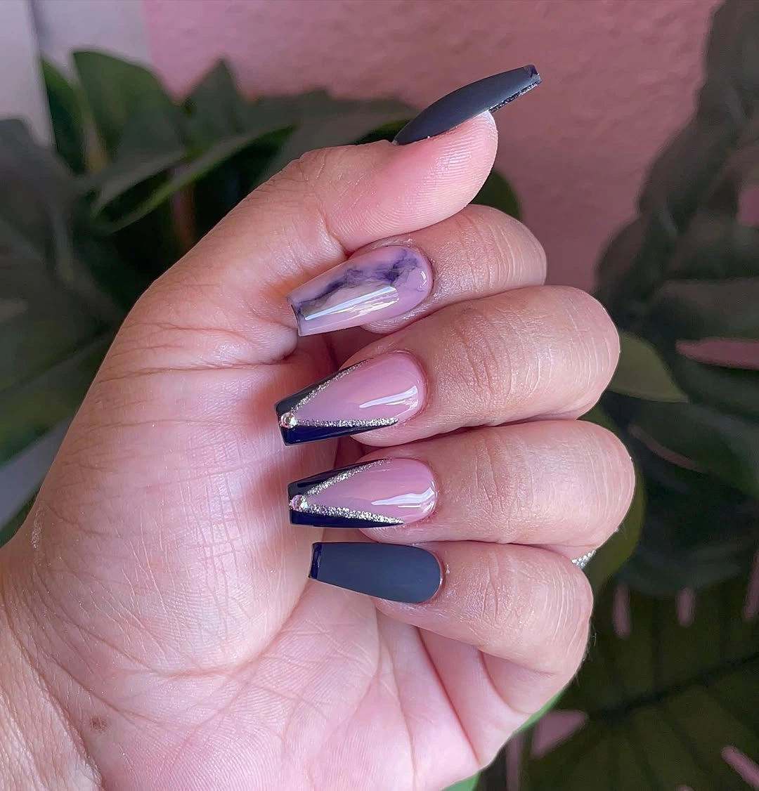 Short navy coffin nails framing pale pink centers