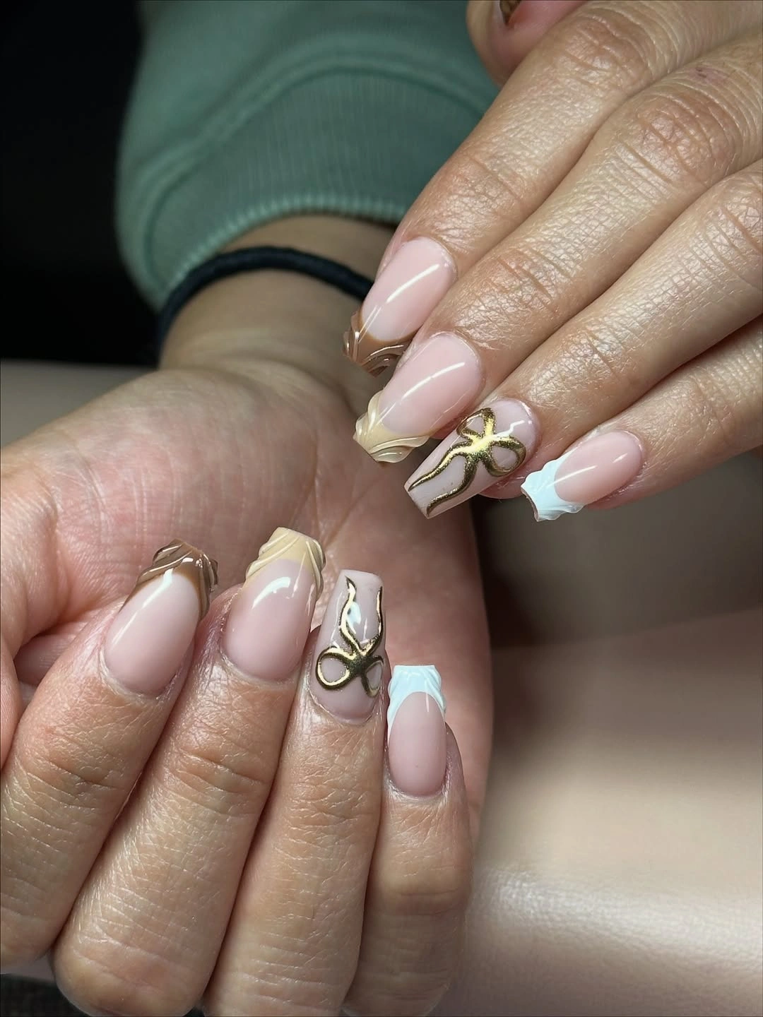 Short nude coffin French nails with one tiny outlined accent