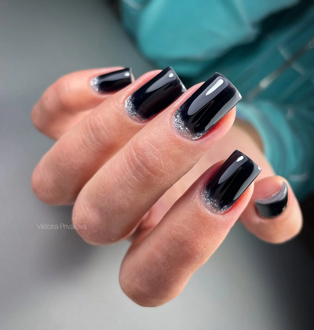 Medium black square nails with pale curved tips