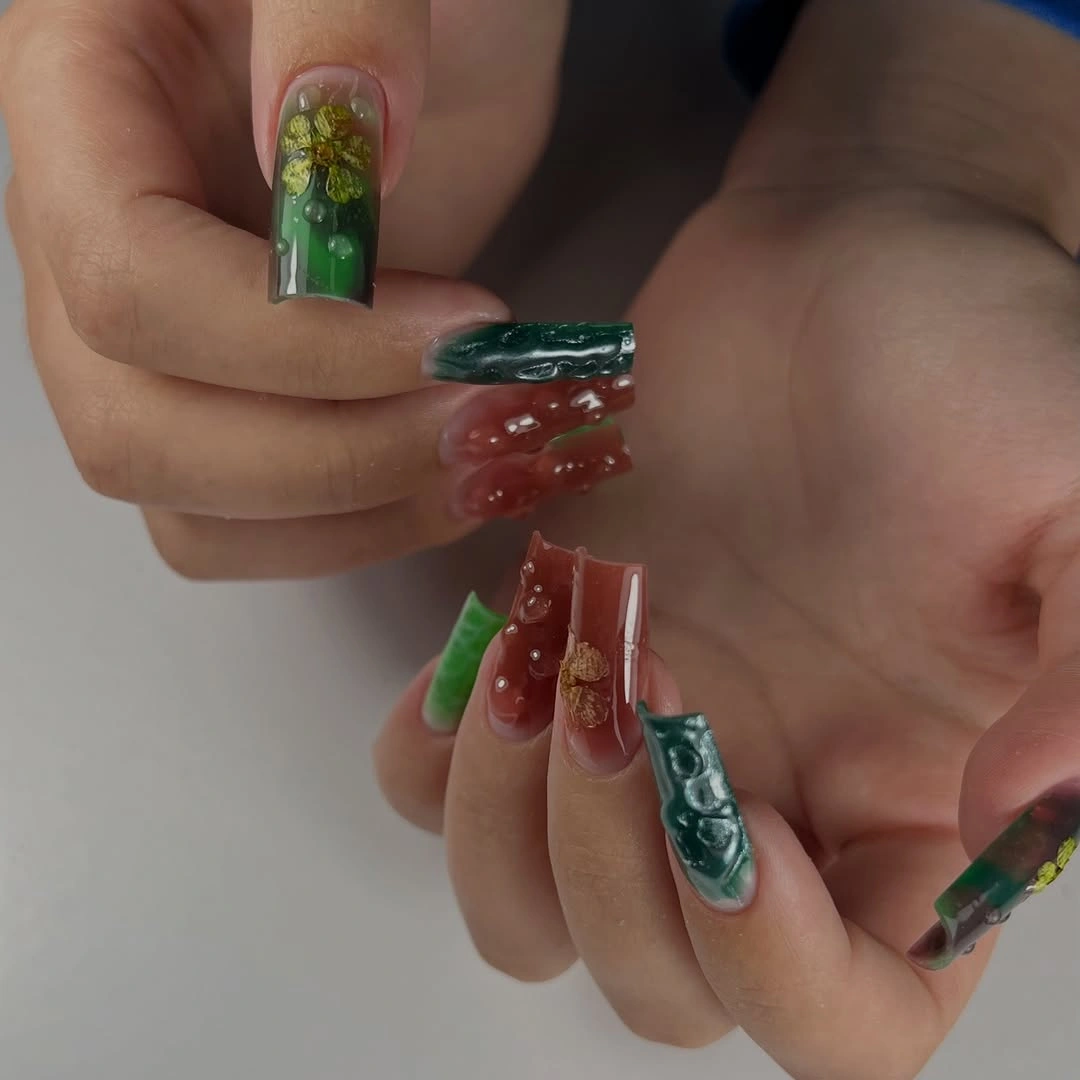 Long square nails with rich green red accents