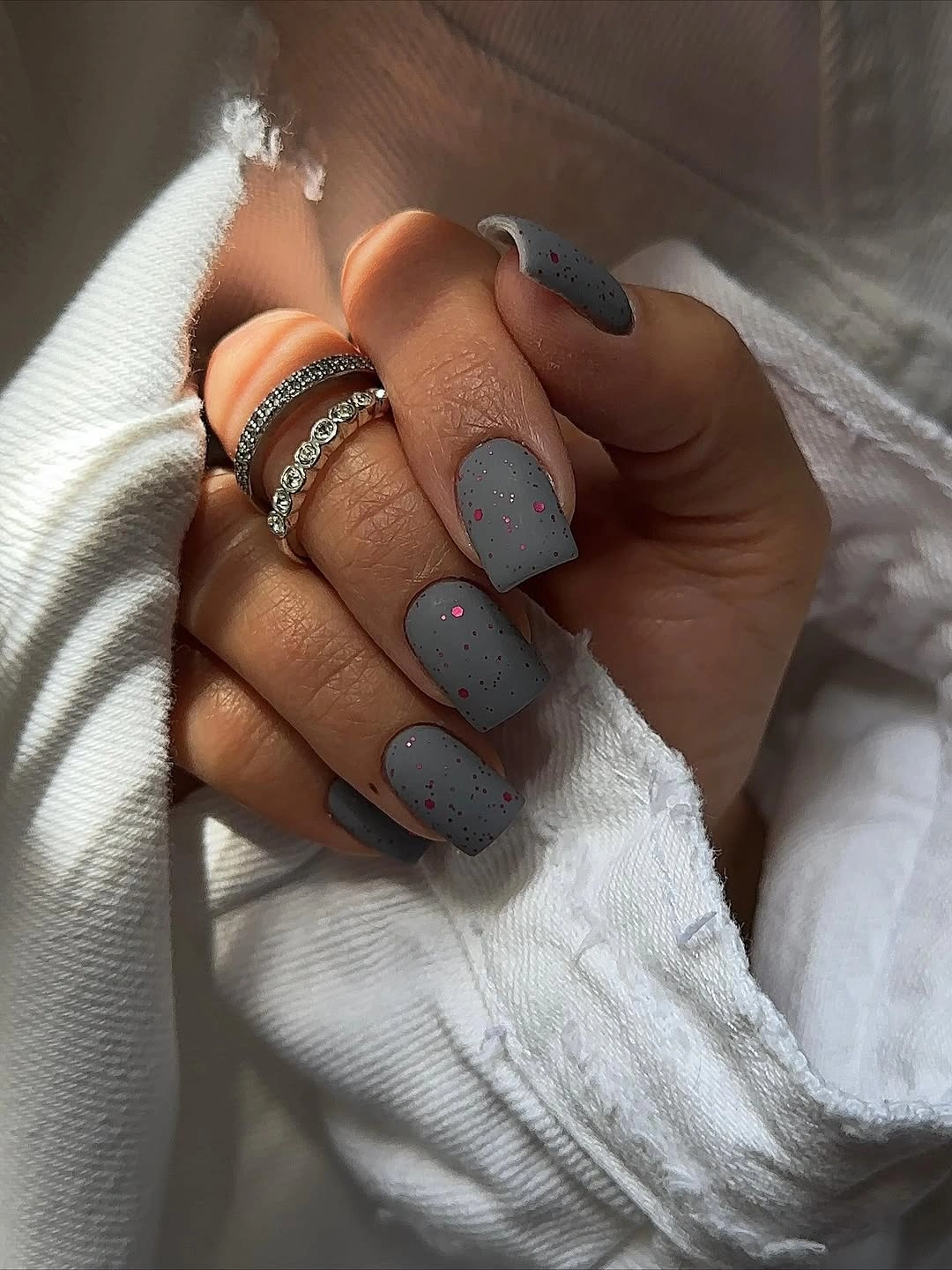 Short matte gray blue square nails with warm dots