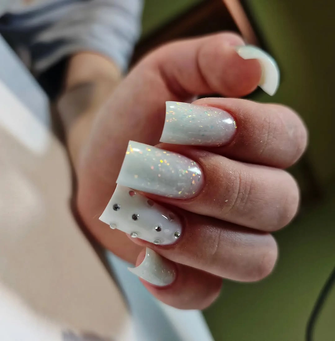 Medium milky square nails with tiny accents