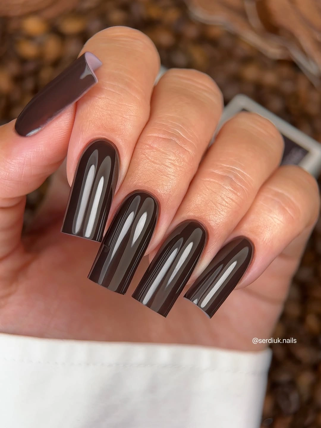 Long dark square nails with pale vertical stripes