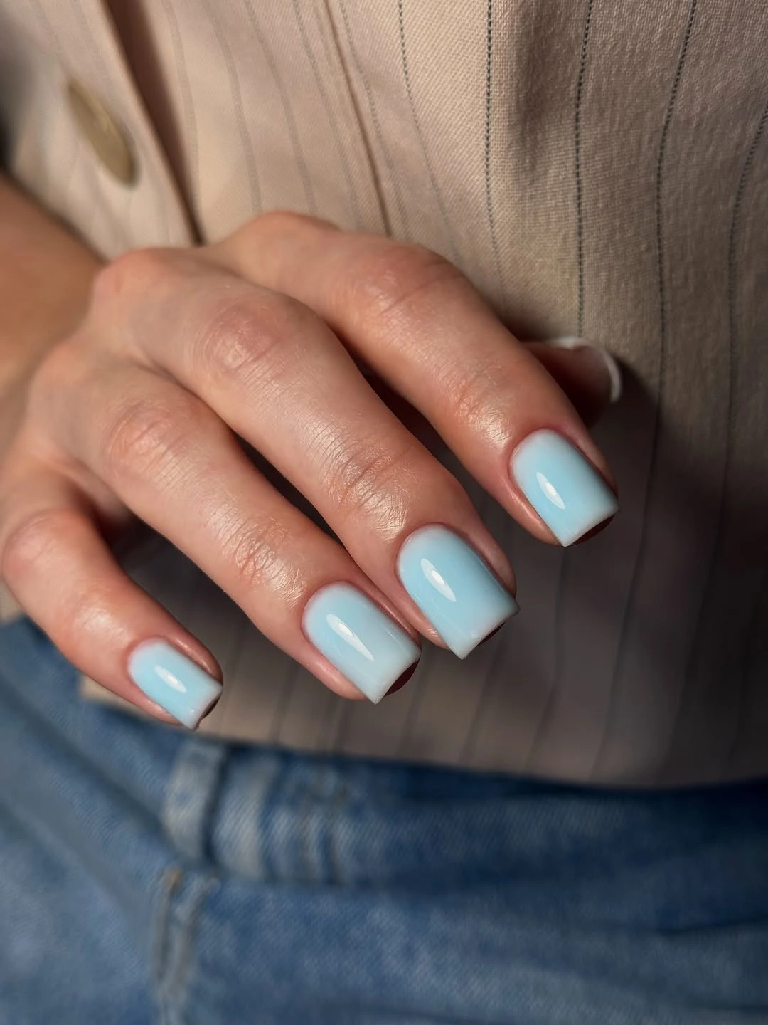 Short glossy pale blue square nails